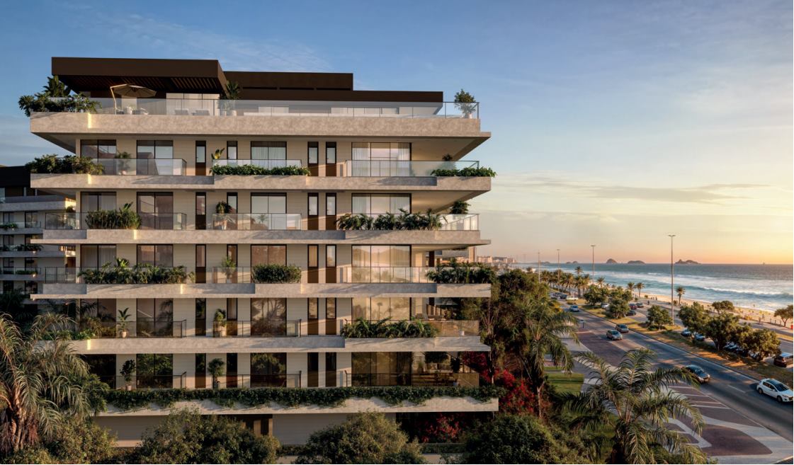 Fachada do RIIO by Piero Lissoni ao entardecer, com a orla da Barra da Tijuca ao fundo